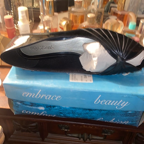 Cagey pump. 2 inch heel. Black Patent leather. 12 wide. Lightly used. - Picture 2 of 3